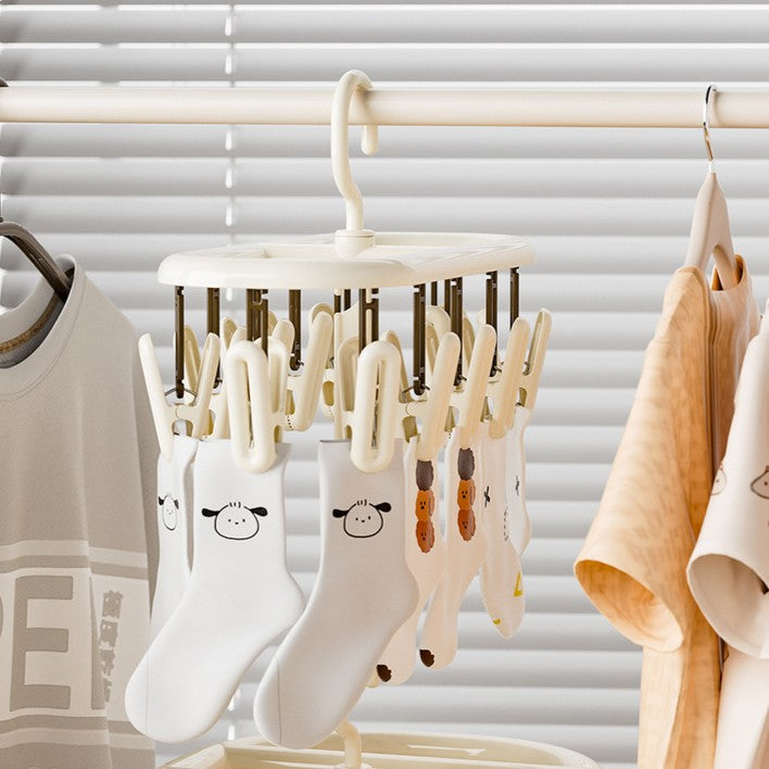 Cream-coloured plastic clothes horse with multiple clips [12 clips]